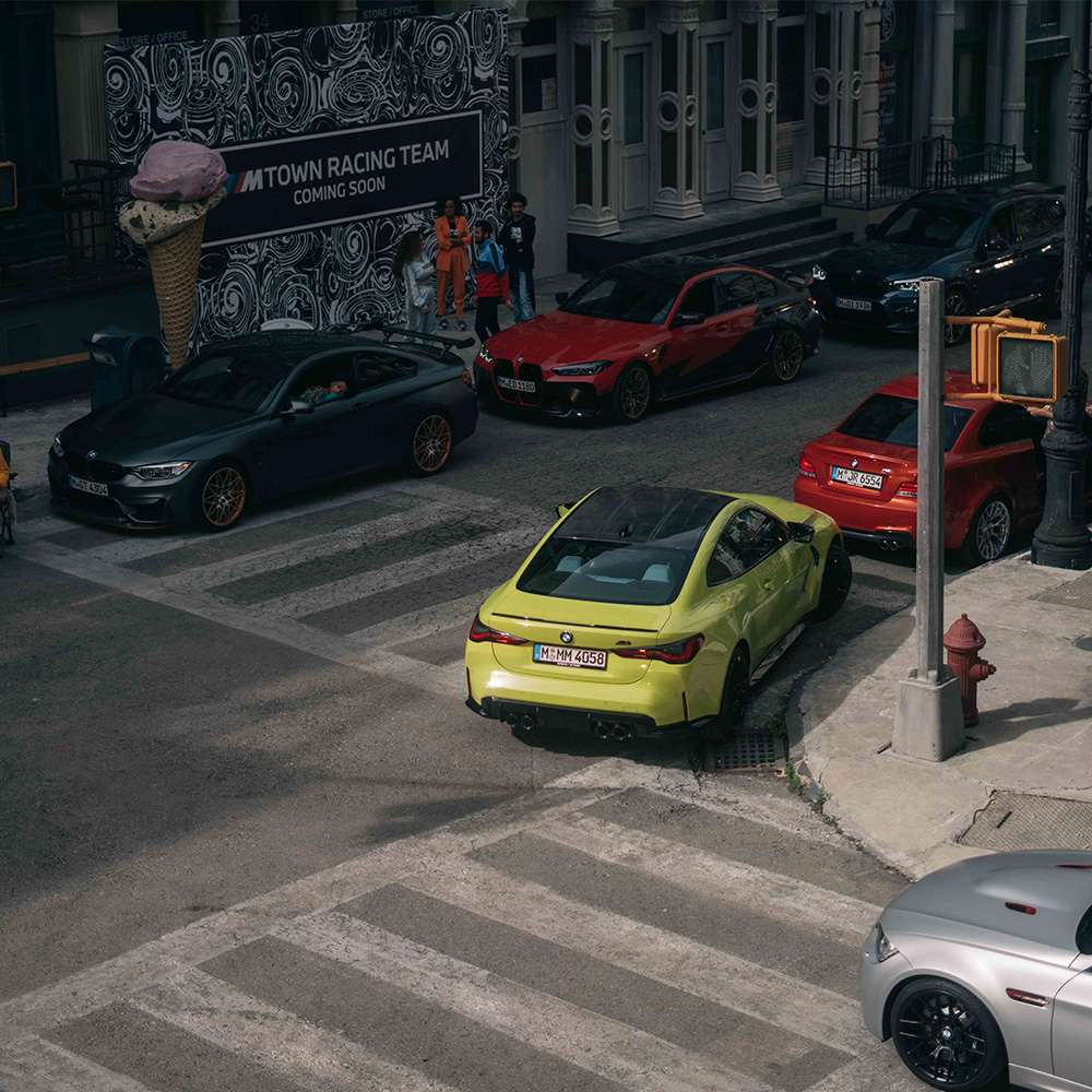M Town street scene with ice cream sculpture and BMW cars
